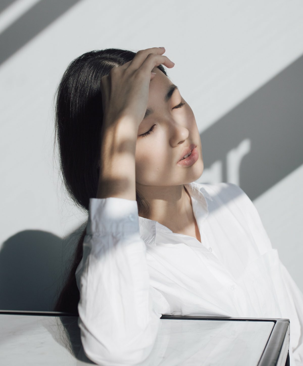 New York Dermal Fillers model wearing a white blouse
