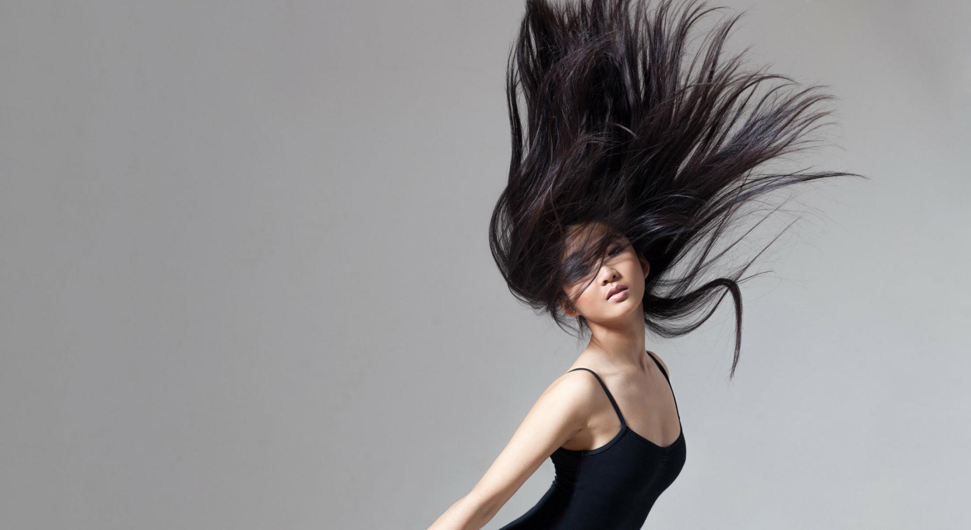 New York Hair Restoration model with long black hair